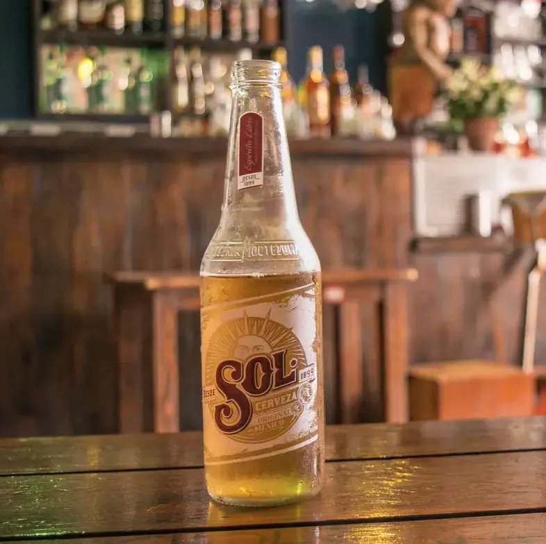 A beer on a wooden table